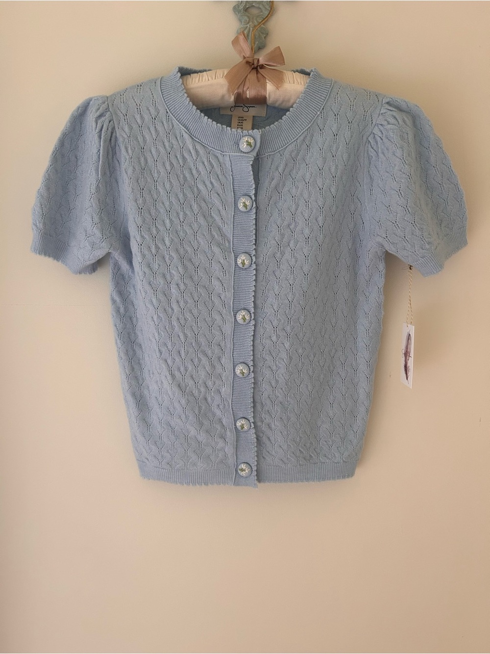 Jessica Simpson Baby Blue Heart Knit Cardigan with Floral Buttons
Size: XS
NWT